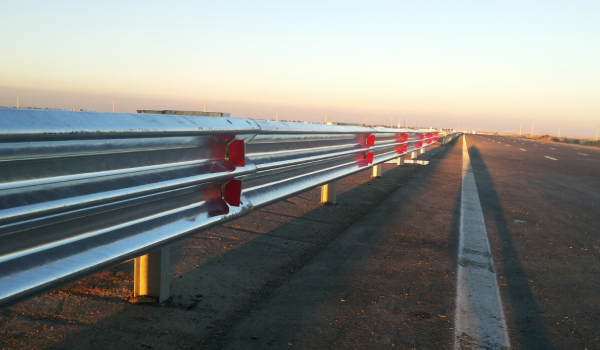 Long stretch of highway at sunrise